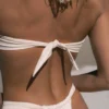 Back view of Riviera off-white bikini worn by model at the beach Acuarela Brand
